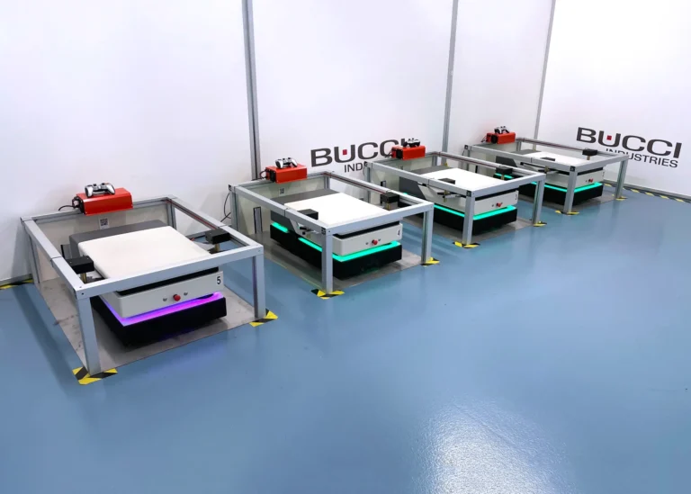 Fleet of 4 Helko AMRs at charging station inside hospital application for Bucci Industries